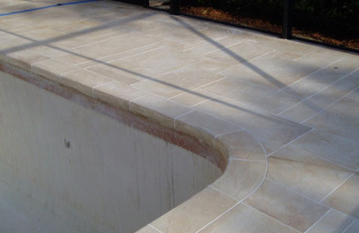 Faux Travertine Tiles Around Pool