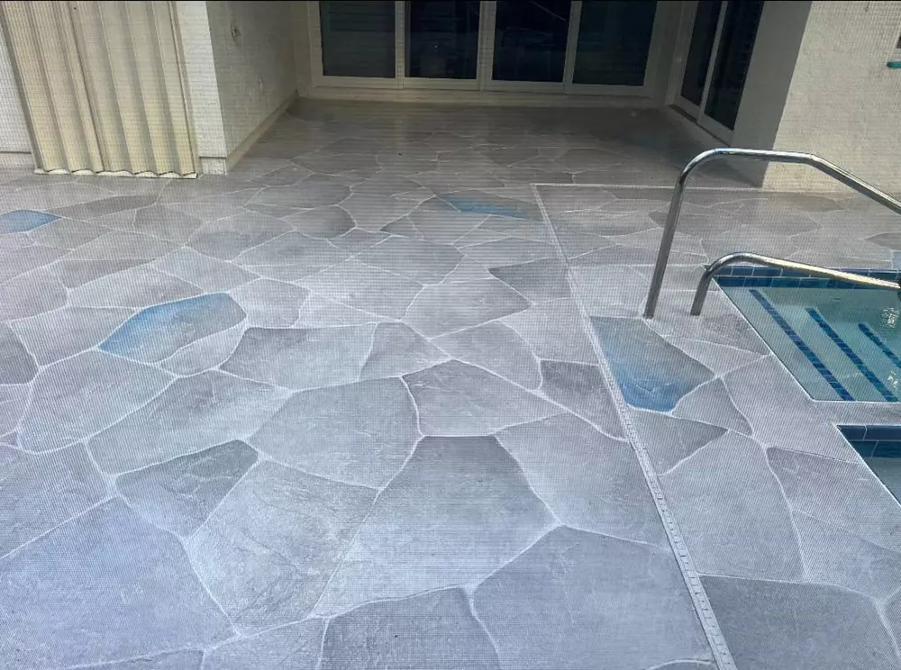 Palm Beach County pool deck resurfacing updated to look like stone